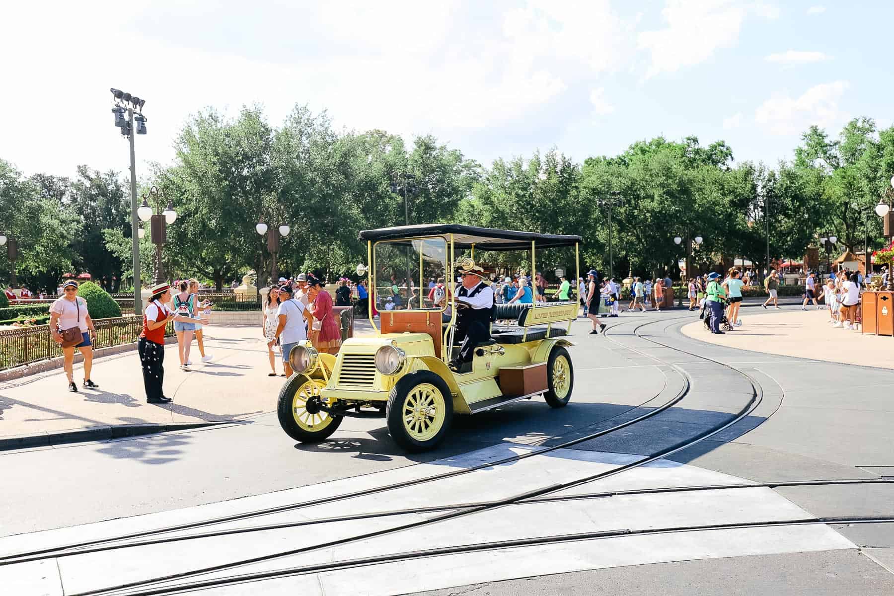 A driver is taking the yellow street car to retire it for the day. 