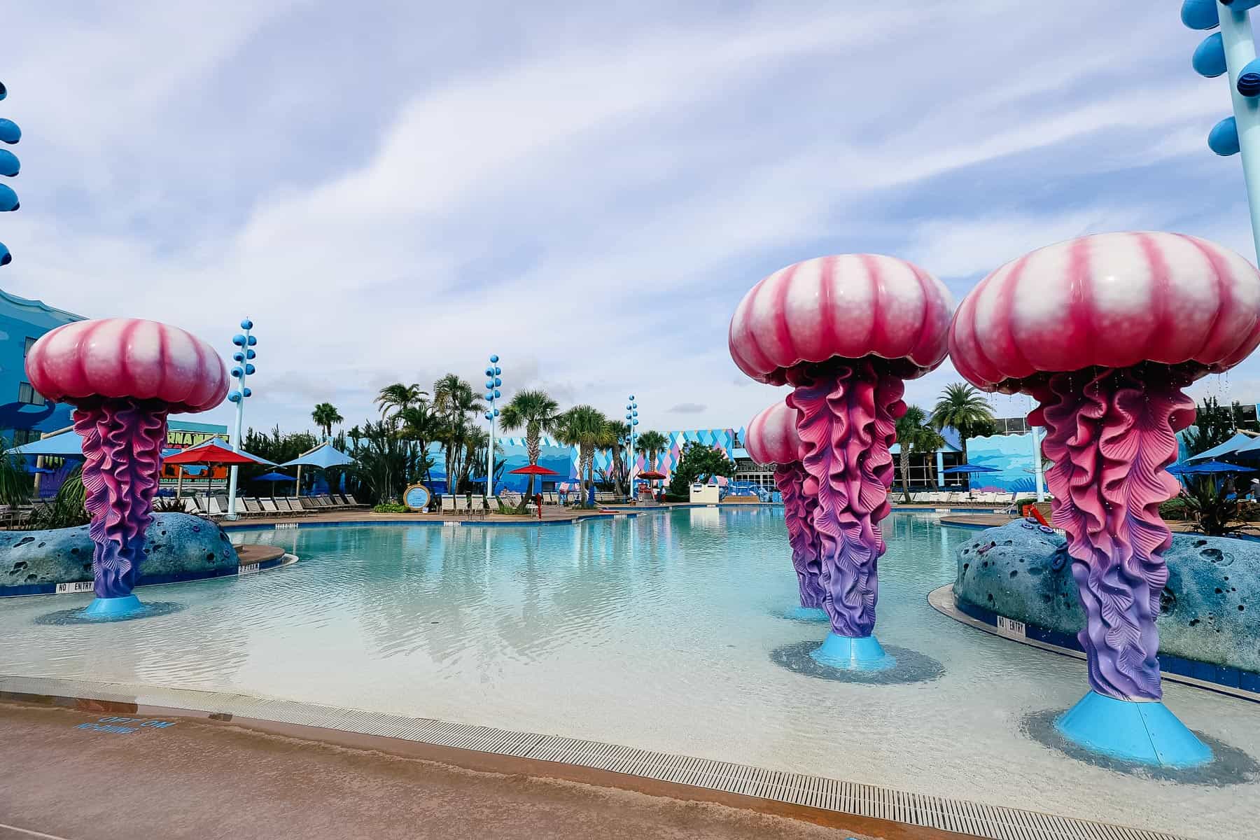 The Big Blue Pool at Walt Disney World has large jellyfish accents in blue and pink. 