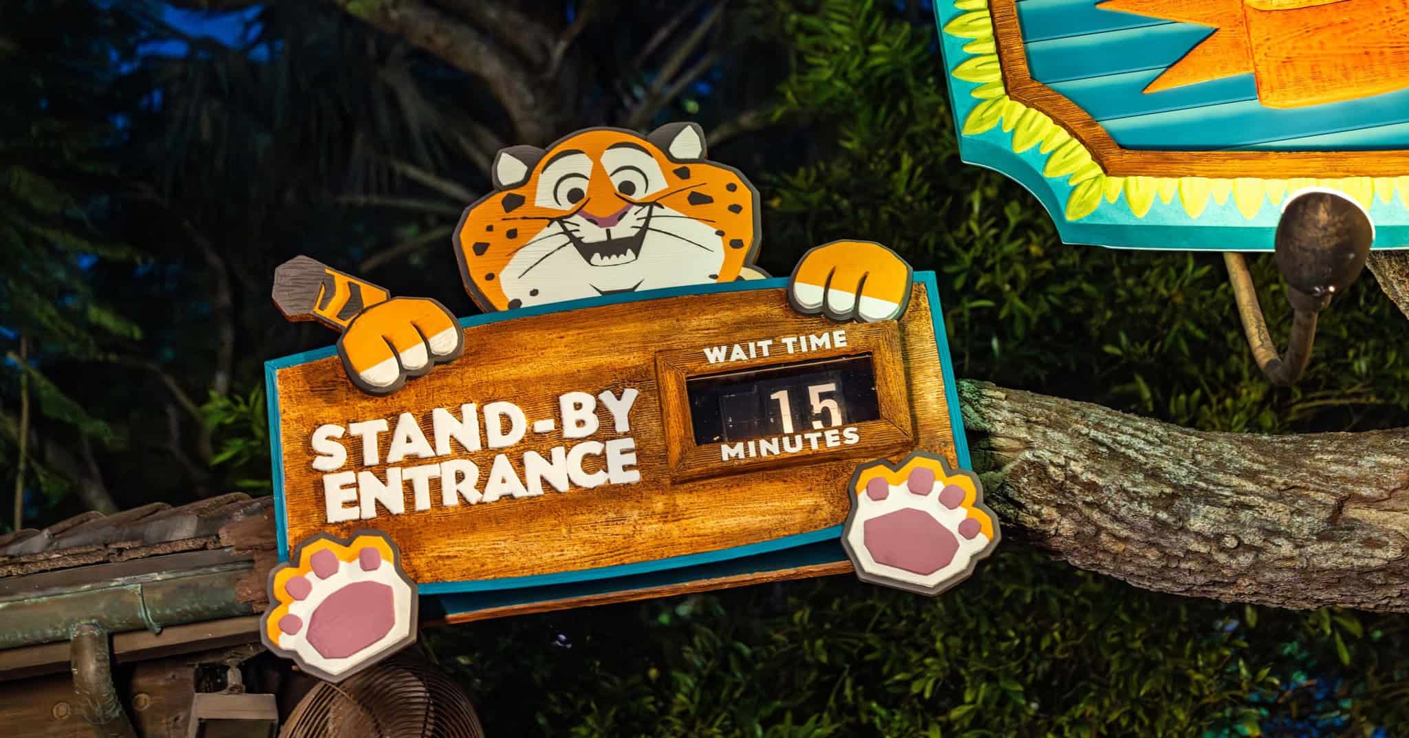 Clawhauswer holds the standby entrance sign at the Tree of Life Theater